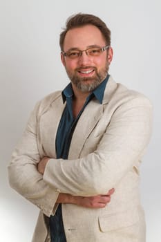Attractive man standing on a bright background