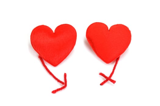Two red hearts in love on white background