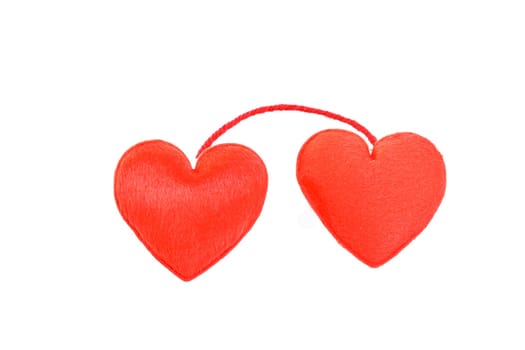 Two red hearts in love on white background