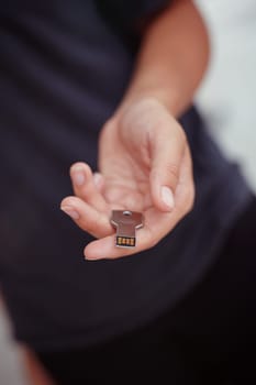 USB stick in the form of a key in a woman's hand.