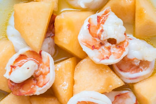 Fried prawns on Charentais melon with spicy marinade