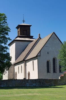 The Church in Vamlingbo, Gotland, Sweden with a clear blue sky.