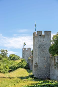 Town Wall in Visby, Gotland with the Swedish flags.