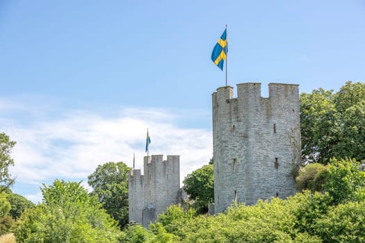 Town Wall in Visby, Gotland with the Swedish flags.