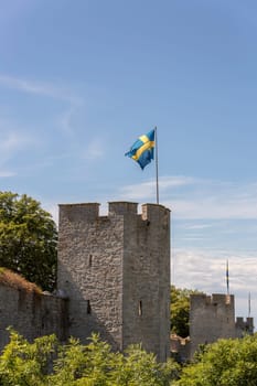 Town Wall in Visby, Gotland with the Swedish flags.