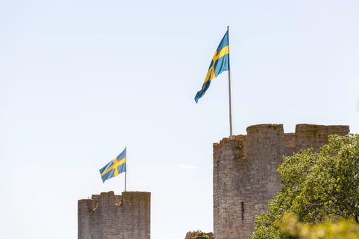Town Wall in Visby, Gotland with the Swedish flags.