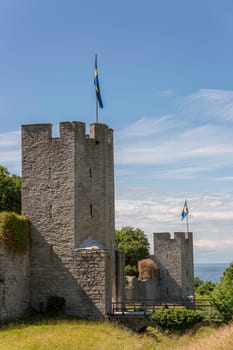 Town Wall in Visby, Gotland with the Swedish flags.