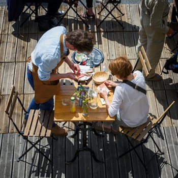 Paris, June 5, 2017 : people is havin lunch in a terrace restaurant, relaxing and friendly moment, style of life.
