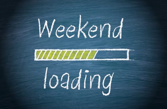 Weekend loading, blue chalkboard with text