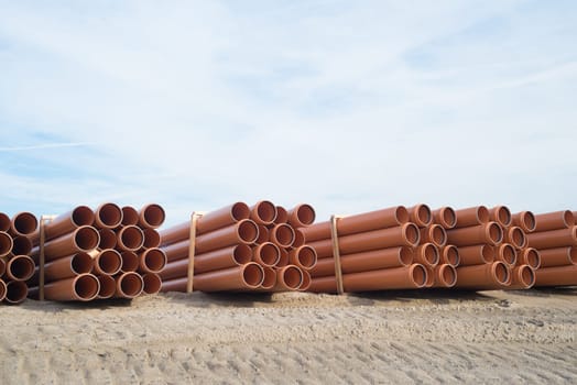 stack of pvc pipes on a construction site