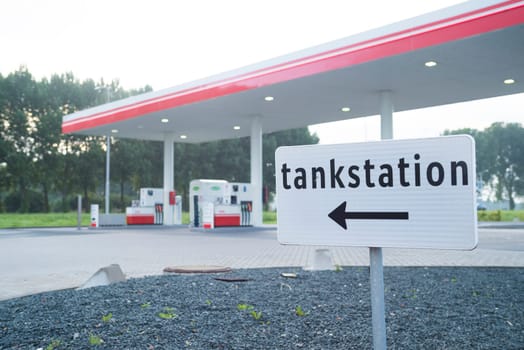 direction shield in front of an unmanned gas station in the netherlands
