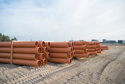 stack of pvc pipes on a construction site