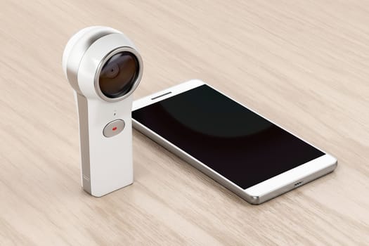 360 degree camera and smartphone on wood background