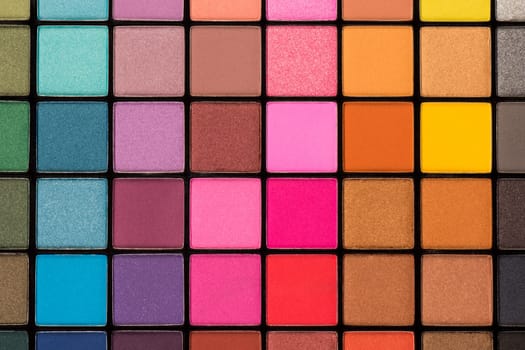 Colorful eye shadow palette with a lot of different colors.
