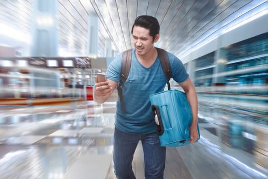 Young asian tourist rushing to boarding a plane on the departure area