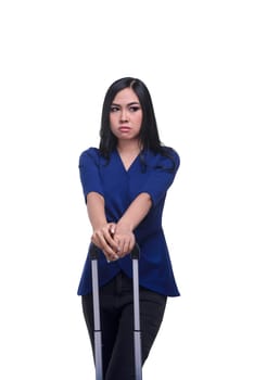 Young asian woman holding suitcase handle isolated over white background
