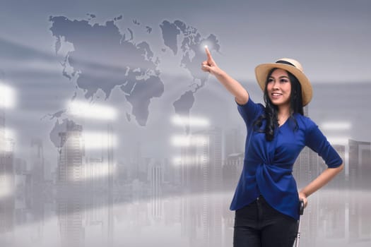 Beutiful asian woman touching travel destination on virtual screen over futuristic background