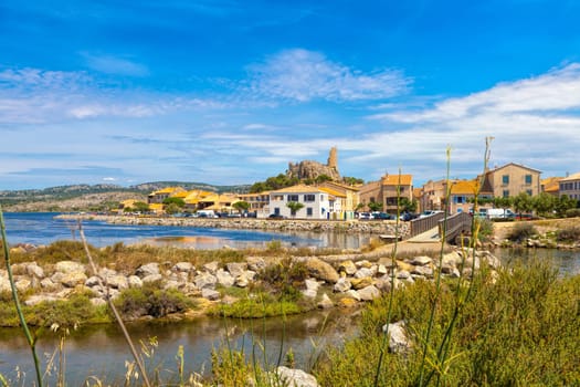 The medieval town of Gruissan in southern France with the old castle ruins Tour Barberousse located on the Etang de Gruissan.