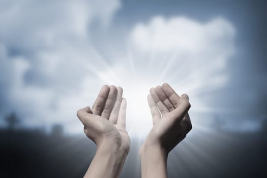 Human hand praying to god. Religious concept image