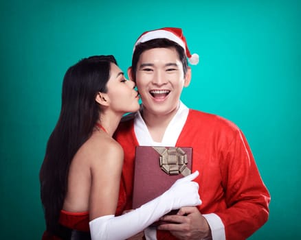 Santa woman give kiss to her lover. Christmas concept