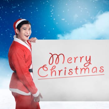 Asian man wearing santa claus costume holding banner with merry christmas writing