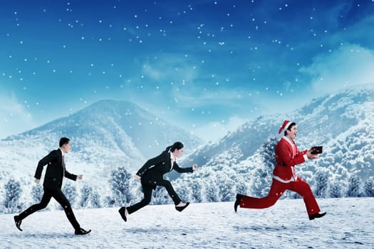 Business people chasing santa claus. Christmas bonus concept