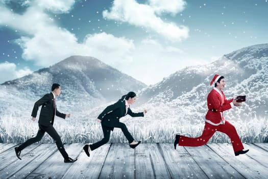 Business people chasing santa claus. Christmas bonus concept
