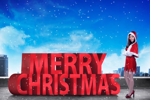Pretty asian woman standing with merry christmas 3D text. Christmas concept