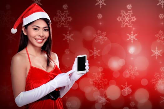Asian woman in santa claus costume holding cellphone. Christmas concept
