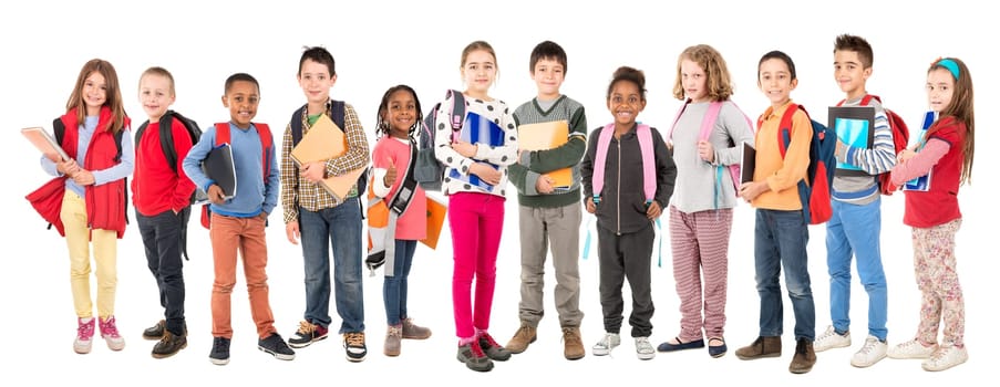 Group of school children posing isolated in white