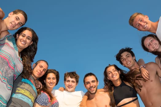 Group of happy teenage friends at the beach