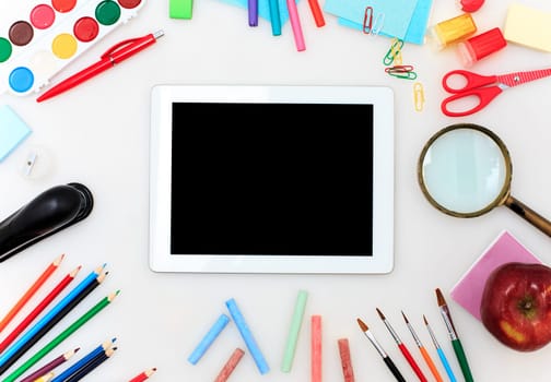 School set with back to school inscription, notebooks, tablet, pencils, brush, scissors and apple on white background