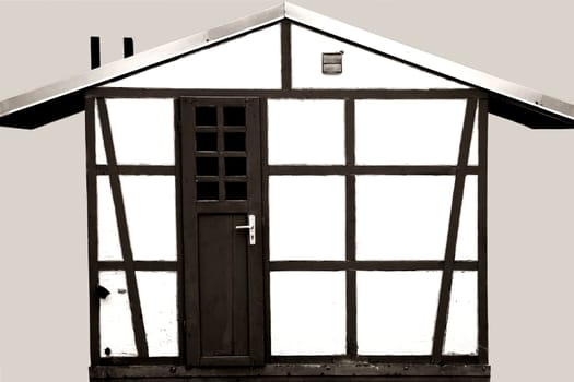 A half-timbered garden shed for storing garden tools and material.
