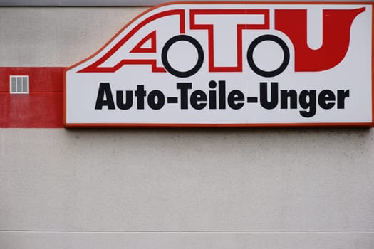 Mainz,Germany - July 16,2017: The company sign of the garage and tire changer ATU,Auto Teile Unger,on the façade of a building on July 16,2017 in Mainz.