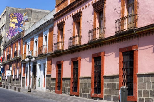 PUEBLA, MEXICO-MARCH 2: Red building in street in downtown in Puebla, Mexico on March 2, 2017