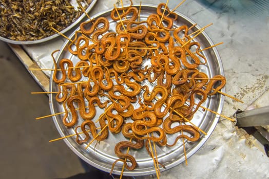 grilled snakes on sale for food market in China.