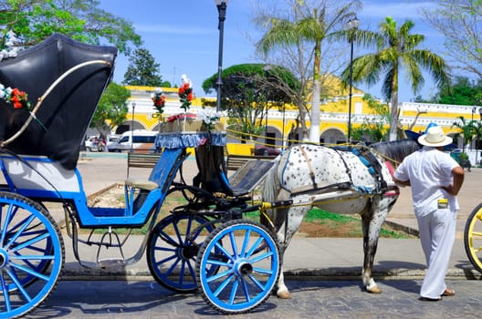 IZAMAL, MEXICO - FEBRUARY 19: View of tourist carriages in street in Izamal, Mexico on February 19, 2017