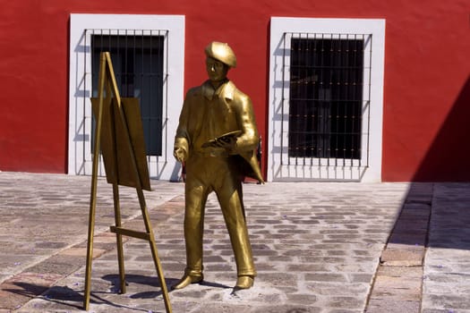 PUEBLA, MEXICO - MARCH 2: Statue of a painter on the main square in the artists neighborhood in Puebla, Mexico on March 2, 2017