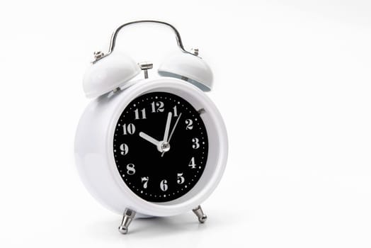 Retro alarm clock isolate on white backgound.