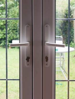 two locked backdoor handles up close garden  England  UK