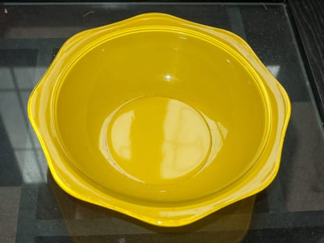 a yellow empty bowl sitting on table  England  UK
