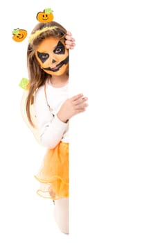 Girl with face-paint and Halloween pumpkin costume isolated in white
