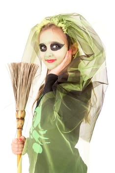 Girl with face-paint and Halloween witch costume over a white background
