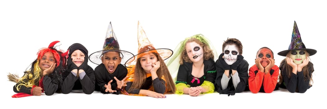 Kids with face-paint and Halloween costumes isolated in white