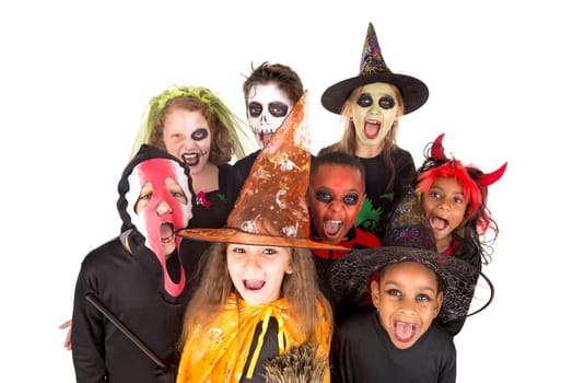Kids with face-paint and Halloween costumes isolated in white