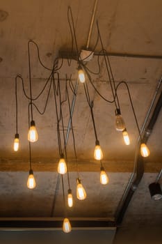 Antique light bulbs hanging on the ceiling, stock photo