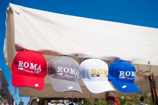 ROMA, ITALY - OCTOBER 16, 2016: souvenir shop with roma caps in different colors
