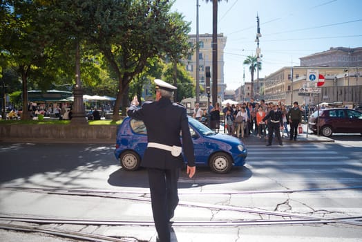 ROMA, ITALY - OCTOBER 16, 2016: Roman police officer controlling traffic in the city center