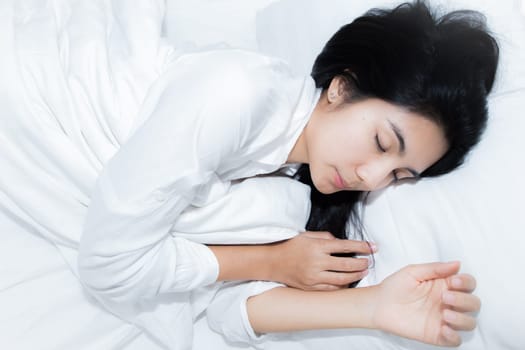 Happy young beauty women sleeping and smile on bed in the morning
