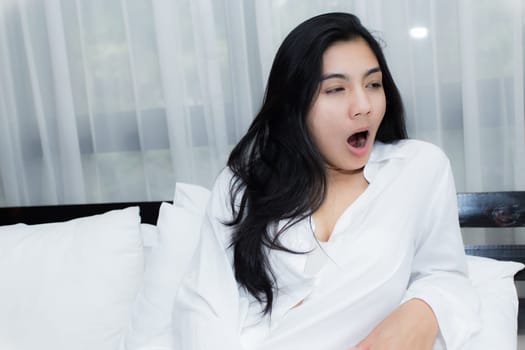 Happy young beauty women sleeping and smile on bed in the morning